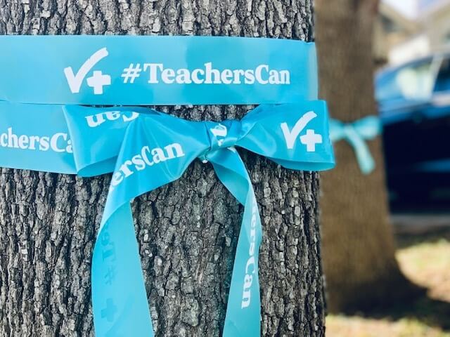Blue ribbon tied around tree to spread awareness that teachers can